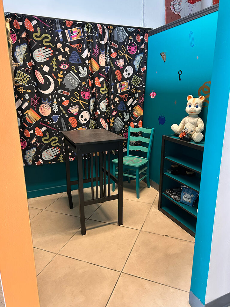 Artist studio with teal walls